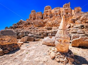 Antique statues on the top of Nemrut mountain at sunrise, Turkey