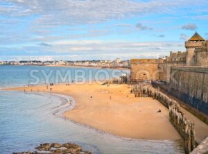 Atlantic beach under the towers of city walls in St Malo, Brittany, France