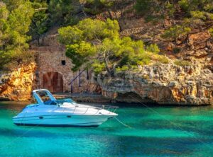 Beautiful white yacht in harbor of Cala Figuera, Mallorca, Spain