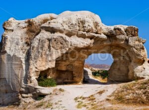 Bizarre hole in a rock formation in Cappadocia, famous tourist destination in central Turkey known for its unique geological landscapes