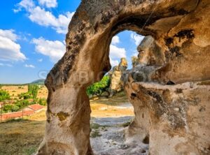 Bizarre stone arch in a sandstone rock formation in Cappadocia, Turkey