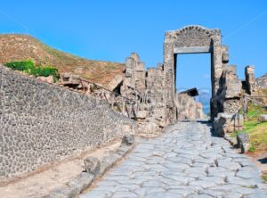 Cobbled street in antique roman town Pompeii, Naples, Italy