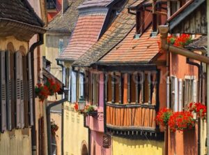 Colorful houses in a street in alcacian village by Colmar, Alsace, France