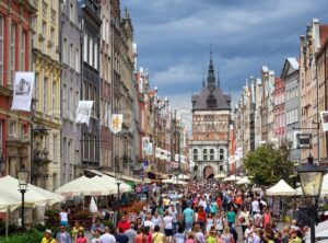 Crowded pedestrian street in Gdansk, Poland, on a summer evening