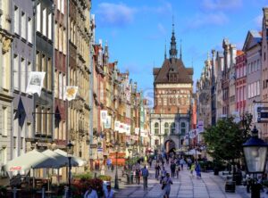 Crowded pedestrian street in Gdansk, Poland, on a summer evening