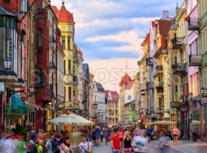 Crowded pedestrian street in european town Torun, Poland