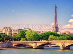 Eiffel tower rising over Seine river, Paris, France