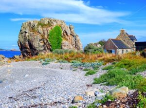 House and a rock on atlantic beach, Brittany, France
