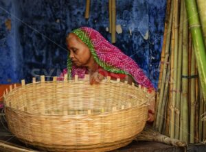 Indian woman in traditional clothes making a basket, Jodhpur, India - GlobePhotos - royalty free stock images