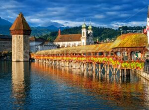 Lucerne, Switzerland, Chapel Bridge, Water Tower, Jesuit Church skyline on sunrise