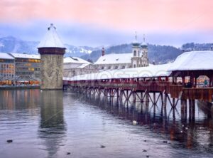 Lucerne, Switzerland, Chapel bridge, Water tower and Jesuit church on a winter evening