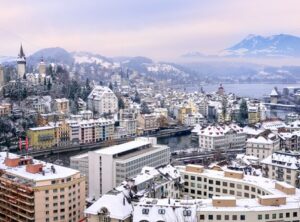 Lucerne, Switzerland, view of the old town, city wall towers, and Alps mountains