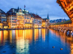 Lucerne, Switzerland, view of the old town from wooden Chapel bridge in the evening