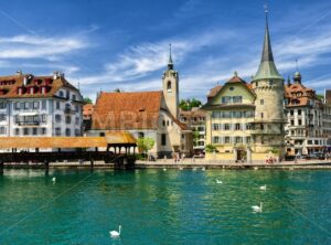 Lucerne, Switzerland, view over Reuss river to the old town, the Chapel and wooden Chapel bridge