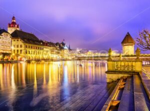 Lucerne, Switzerland. View over Reuss river to the old town and Water tower in the evening.