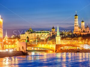 Moscow Kremlin glowing in the evening light over Moskva River, Russia