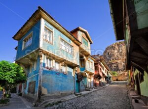 Old traditional ottoman house street with the Karahisar castle in background, Afyon, Turkey