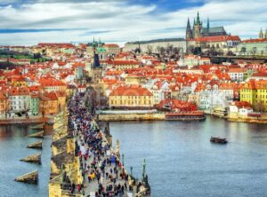 Panorama of Prague with the Castle, Charles Bridge, Vltava river and red roofs of the old town, Czech Republic