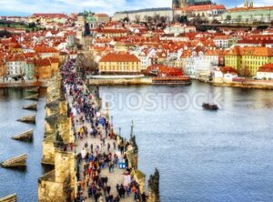 Panorama of Prague with the Castle, Charles Bridge, Vltava river and red roofs of the old town, Czech Republic