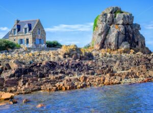 Traditional breton stone house and the rock, Brittany, France