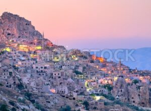 Uchisar cave city in Cappadocia, Turkey on sunset