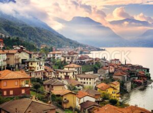 View of Como Lake, Milan, Italy, on sunset with Alps mountains in background