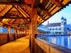 View through historical wooden Chapel Bridge to the old town of Lucerne, Switzerland