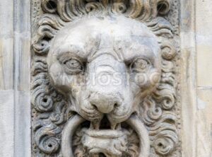 Stone lion head on a wall - GlobePhotos - royalty free stock images