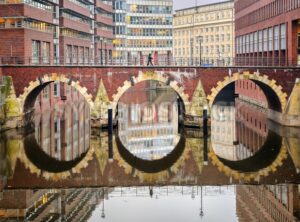 Bridge reflecting in canal in Hamburg city, Germany