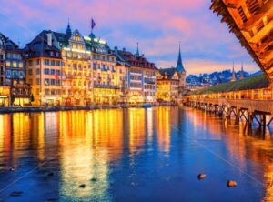 Lucerne, Switzerland, view of the old town from wooden Chapel bridge in the evening