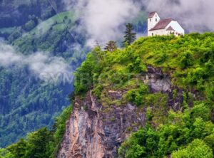 Church on a rock in swiss Alps mountains - GlobePhotos - royalty free stock images