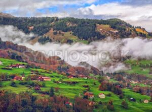 Switzerland Alps mountain misty landscape with clouds - GlobePhotos - royalty free stock images