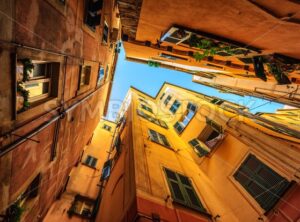 Traditional houses in a narrow street in Genoa, Italy - GlobePhotos - royalty free stock images
