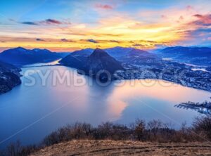 Dramatic sunset over Lake Lugano in swiss Alps, Switzerland - GlobePhotos - royalty free stock images