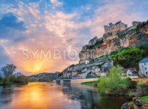 Beynac-et-Cazenac village with medieval Chateau Beynac on dramatic sunset, Dordogne, France - GlobePhotos - royalty free stock images