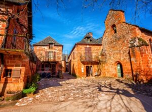 Collonges-la-Rouge, red brick chruch and houses of the Old Town, France - GlobePhotos - royalty free stock images
