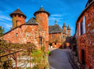 Collonges-la-Rouge, red brick houses and towerd of the Old Town, France - GlobePhotos - royalty free stock images