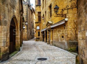 Narrow street in the Old Town of Sarlat, Perigord, France - GlobePhotos - royalty free stock images