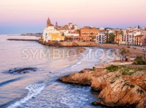 Sand beach and historical Old Town in mediterranean resort Sitges, Spain - GlobePhotos - royalty free stock images