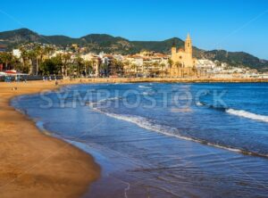 Sand beach and historical Old Town in mediterranean resort Sitges, Spain - GlobePhotos - royalty free stock images
