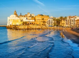 Sand beach and historical Old Town in mediterranean resort Sitges, Spain - GlobePhotos - royalty free stock images