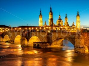 Zaragoza city, Spain, bridge and Cathedral del Pilar at sunset - GlobePhotos - royalty free stock images