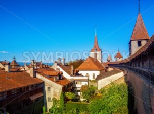Red tiled roofs and wall towers in Old Town Murten, Switzerland - GlobePhotos - royalty free stock images
