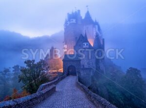 The medieval gothic Burg Eltz castle in the morning mist, Germany - GlobePhotos - royalty free stock images