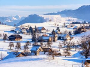 A snow covered village in swiss Alps, Switzerland, in winter time - GlobePhotos - royalty free stock images
