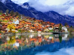 Old town and Alps mountains reflecting in lake, Switzerland - GlobePhotos - royalty free stock images