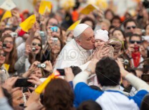 Pope Francis I kisses a child, Vatican City, Rome, Italy - GlobePhotos - royalty free stock images