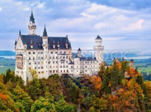 Castle Neuschwanstein in bavarian Alps in early morning light - GlobePhotos - royalty free stock images