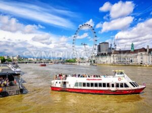 Cruise boat on Thames river, London, England, UK