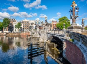 Blauwbrug and Amstel river in Amsterdam city, Netherlands